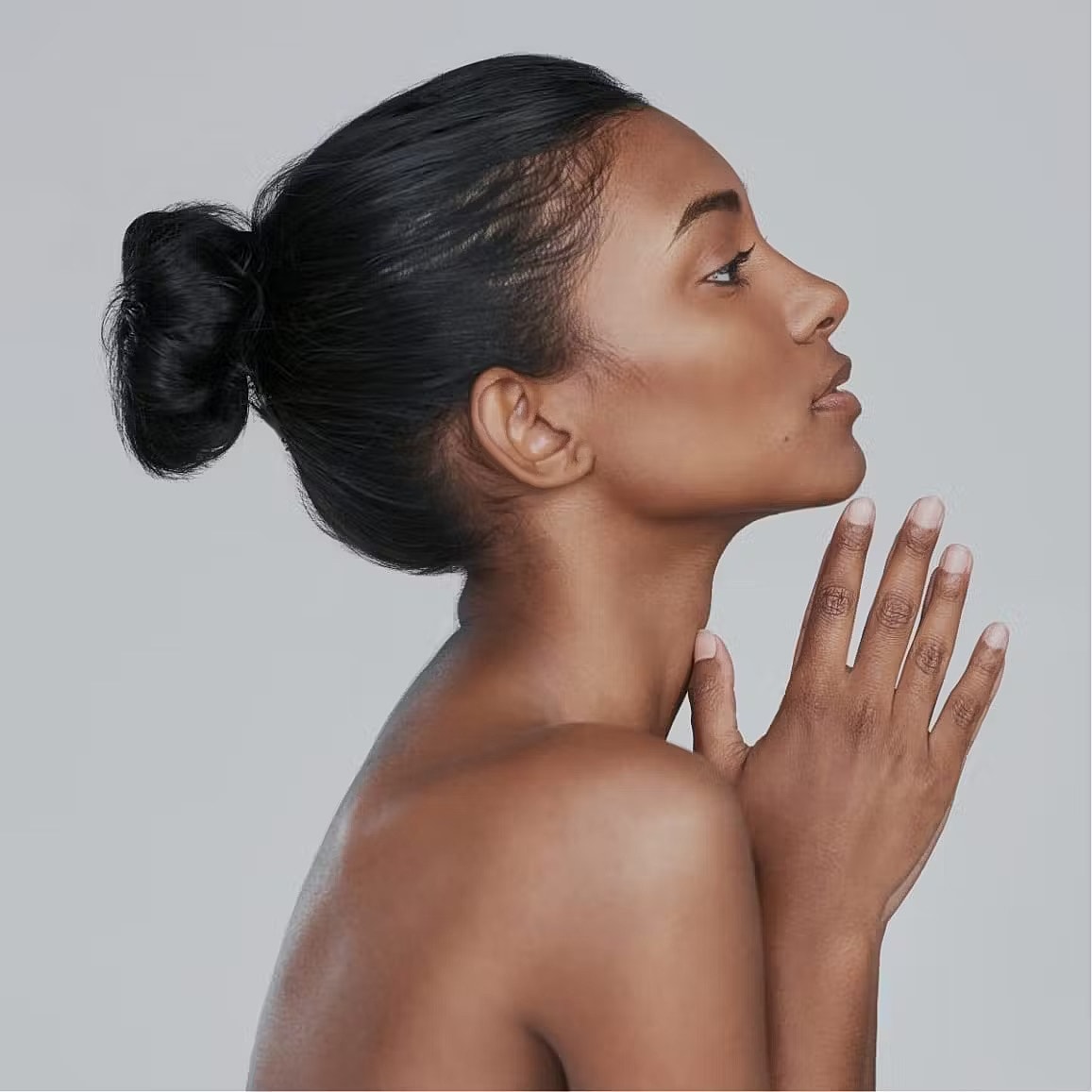 Woman with closed eyes and soft expression.