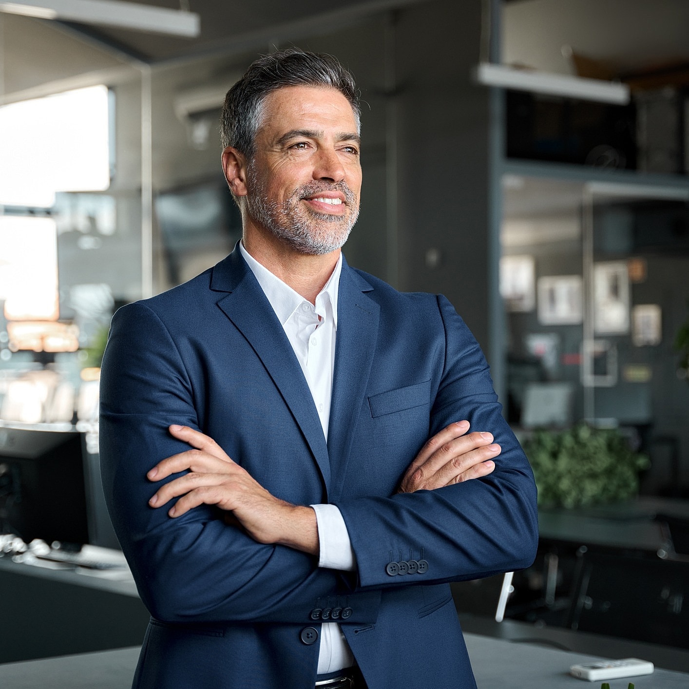 Confident businessman in a modern office setting.