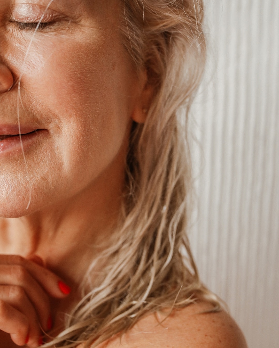 Woman with closed eyes and soft expression.