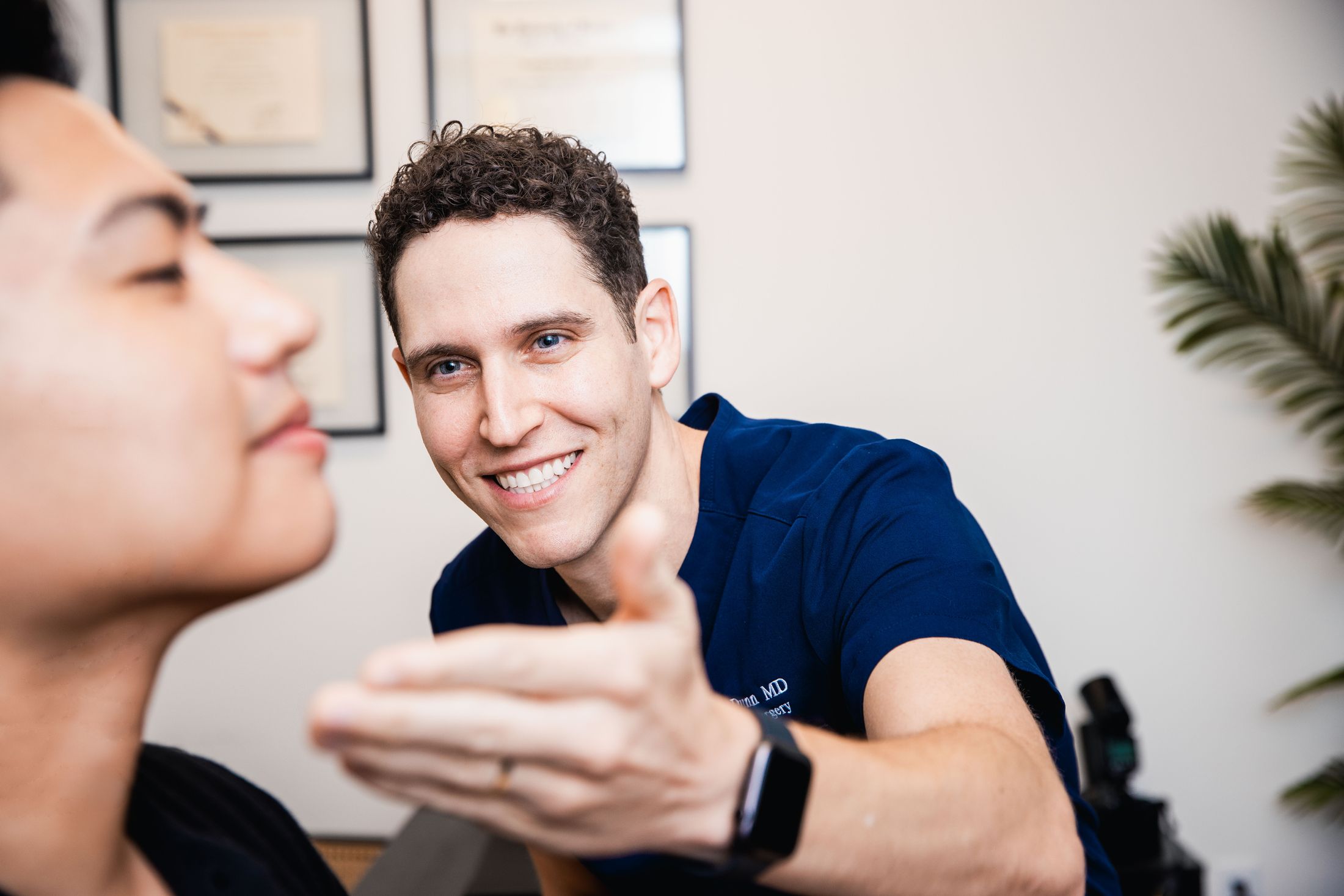 Doctor consulting with patient in office setting.