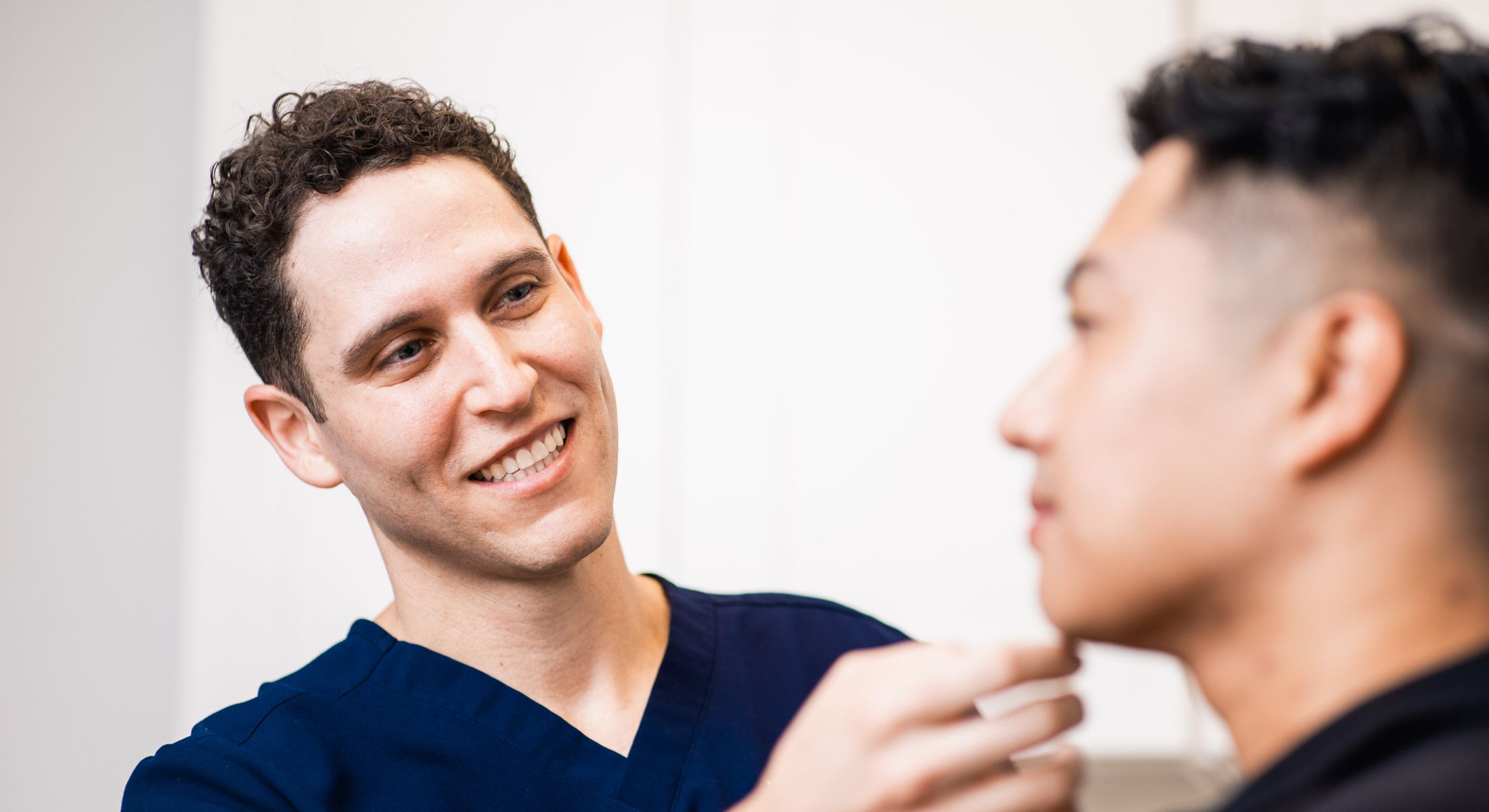 Newport Beach scar revision consultation between doctor and patient in clinic.