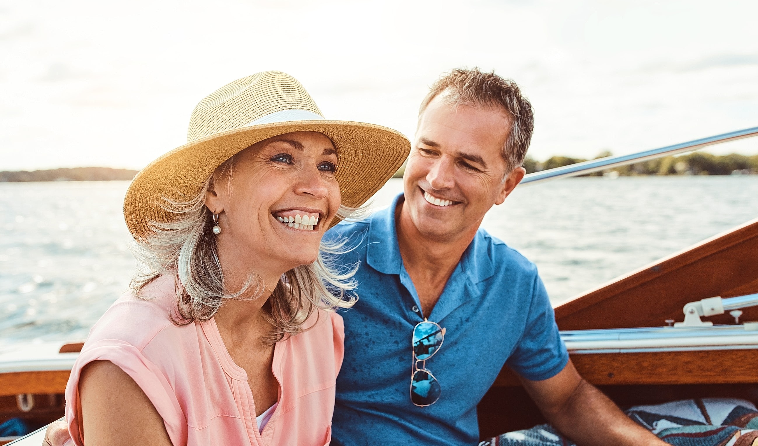 Couple enjoying a joyful moment on a boat.