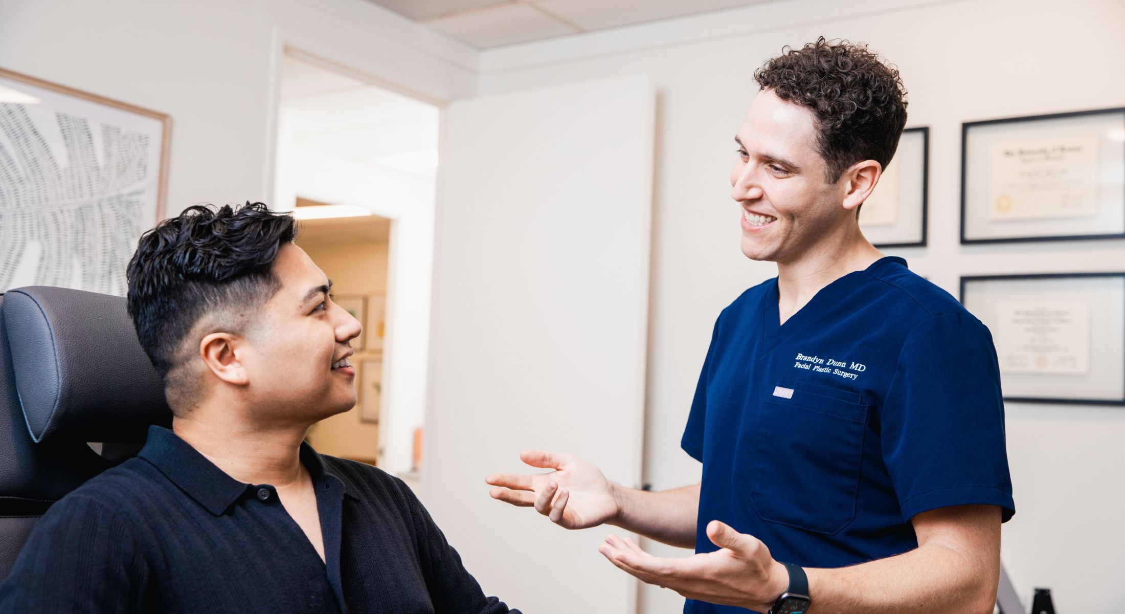 Dentist examining patient in a clinical setting.